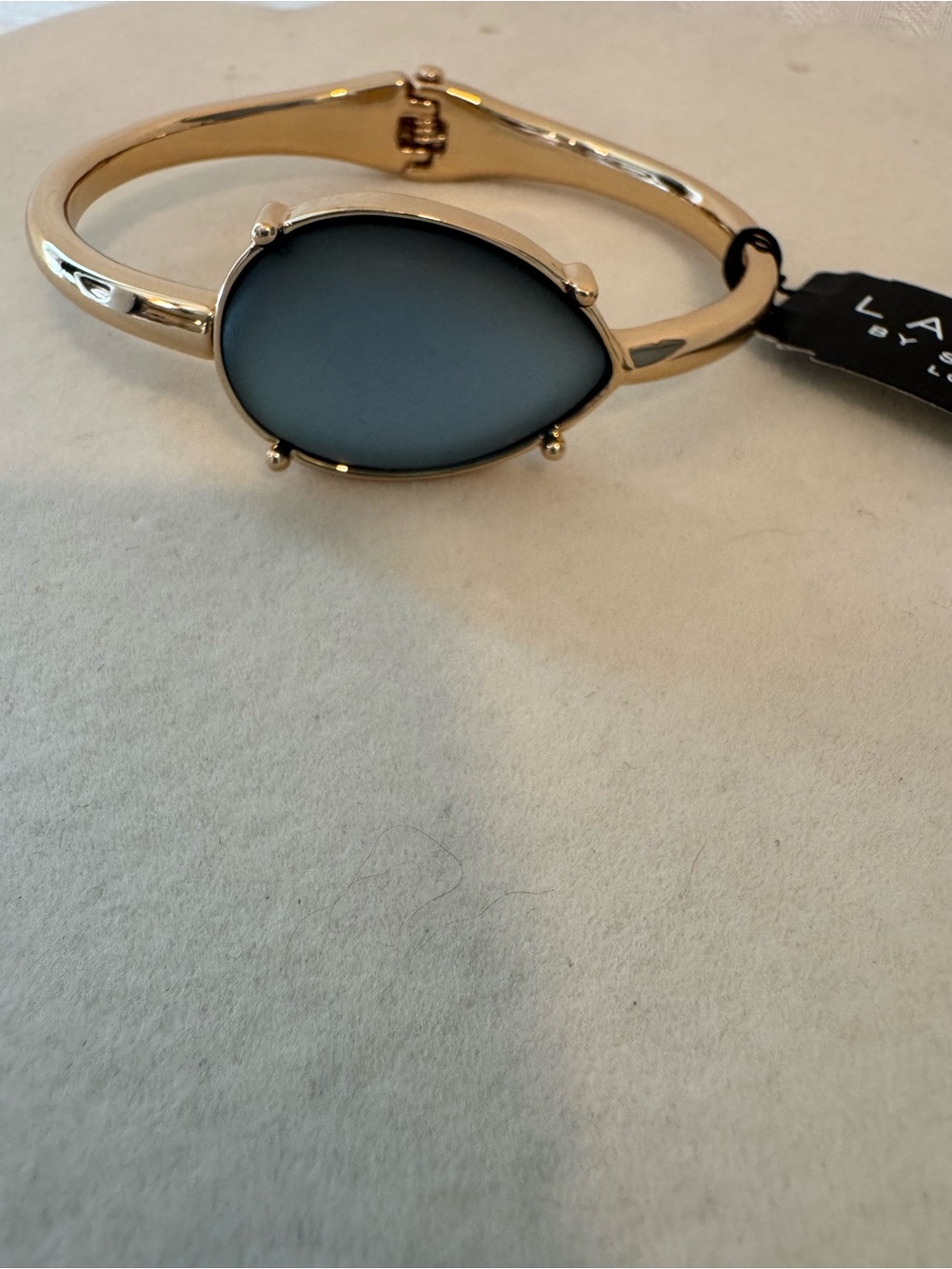 New Laundry Gold Tone Bracelet with Teardrop Blue Grey Stone